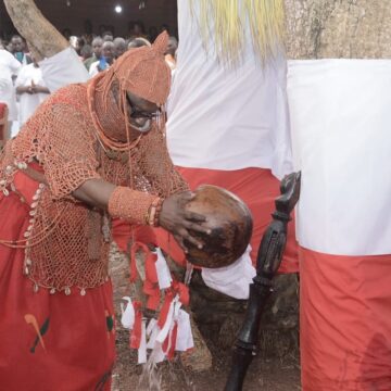 Oba of Benin makes requests at ancestral altars