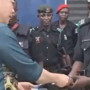 Police discipline officers over cash gifts from foreigner in video